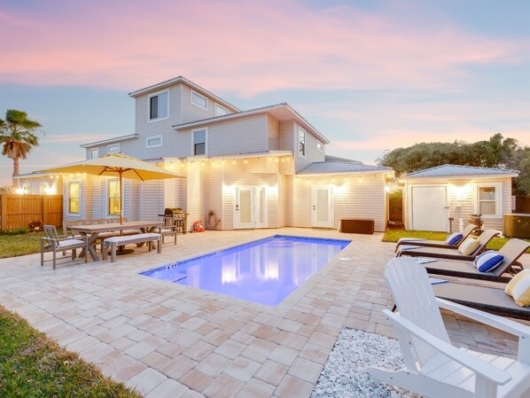 Backyard with pool, grill, tiki hut, fire pit