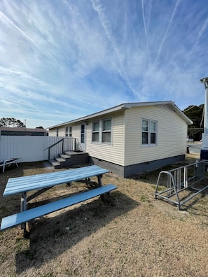 Both front and back steps as well as a front ramp make access to this roomy home easy