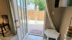 Outdoor showerDoor to back porch and fenced yard