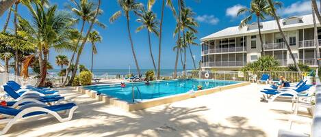 Beat the heat and cool off in the community pool with a stunning oceanfront view.