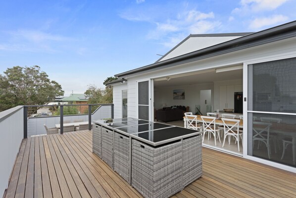 Upstairs spacious deck area with seating available for 12 guests