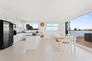 Open plan and light kitchen and dining area