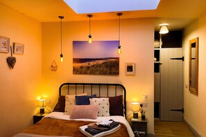 Subtle overhead lighting and a large window over the bed for star gazing at night time