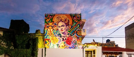 Admire a captivating colorful mural on a wall in Playa del Carmen apartment
