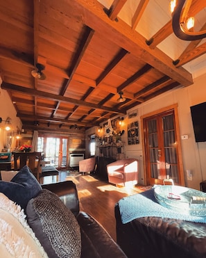 Living room and dining, cozy up by the stone fireplace!