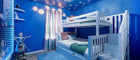 Experience "Paradise Found" with themed rooms like this FROZEN bedroom with a twin over full bunkbed and a twin trundle bed.