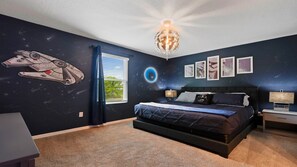 Sleep among the stars in this epic galaxy-themed room, perfect for space lovers!