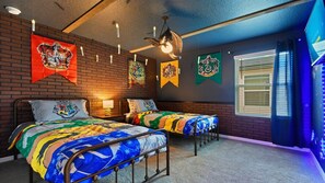 Step into a magical wizard-themed room with floating candles and house banners!