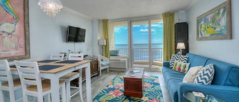 The ocean view living room is well-appointed with comfortable furnishings.
