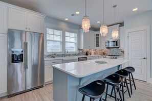 Kitchen has 4 bar stools for entertainment of guests and family gathering 