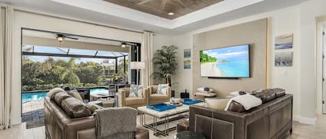 Living Room with 65-inch TV and access to the pool deck.