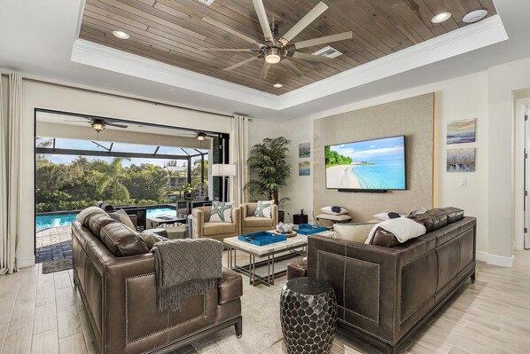 Living Room with 65-inch TV and access to the pool deck.
