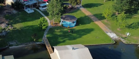 Aerial view of Chestnut Cove Retreat house, gazebo, pier and boat ramp.