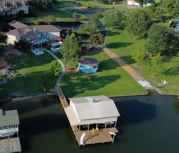 Aerial view of Chestnut Cove Retreat house, gazebo, pier and boat ramp.