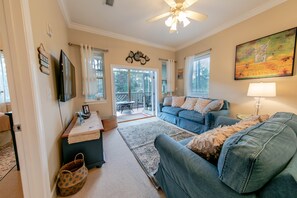 Spacious living area with french doors leading out to screened patio