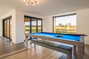 Ground floor: The dining table transforms into a pool table