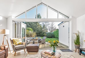 Kittiwake, Highcliffe-on-Sea: The lovely view out to the garden with the bi-folding doors fully opened