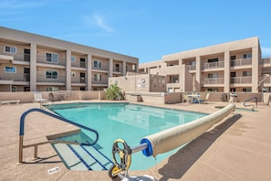 Steps away is the community pool, spa & BBQ grills