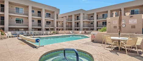 Community Heated Pool and Spa with plenty of outdoor seating & lounging