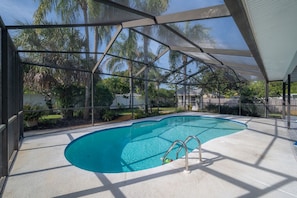 Covered pool with backyard tropical paradise !