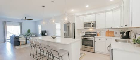 All white Kitchen with stainless appliances