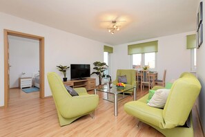   Living area with sofa and TV ideal for rest and relaxation.