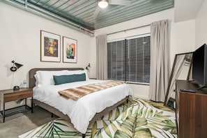Get a restful night's sleep on a memory foam bed in this cozy bedroom.