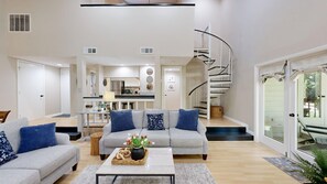 Living Room with Spiral Staircases