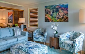 Hanalei vacation Rentals | Hanalei Colony Resort C2 living room - The living room is comfortably furnished in lovely shades of blue that compliment the ocean views! Please note that there is no TV in the unit.