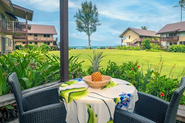 Hanalei Vacation Rentals | Hanalei Colony Resort C2 - Enjoy looking out at the water, just steps away, from your shady and intimate private lanai!