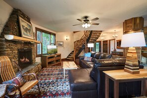 Great room looking toward entry and custom staircase
