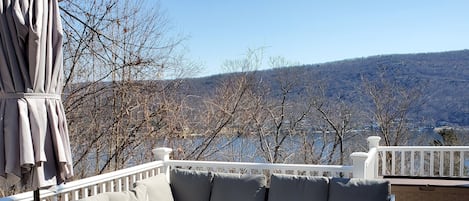 huge dock with a grill and beautiful view of the lake