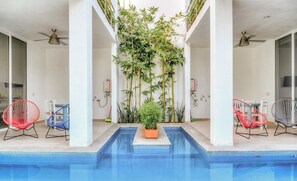 Shared Pool Area with Gas Grill in Boutique Property