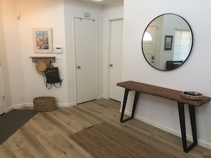 door to laundry and coat closet