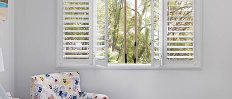 Shutters with view of trees