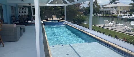 Saltwater pool and spa overlooking the direct access to gulf canal 