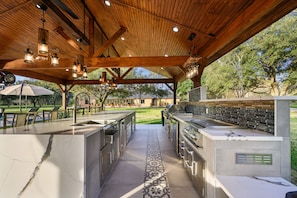 Full outdoor kitchen, perfect for family cookouts next to the pool. 