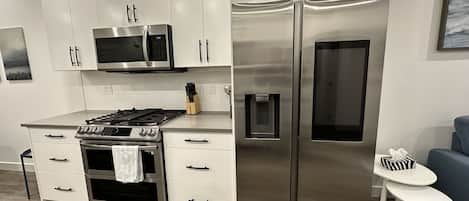 The kitchen has stainless steel higher end appliances.