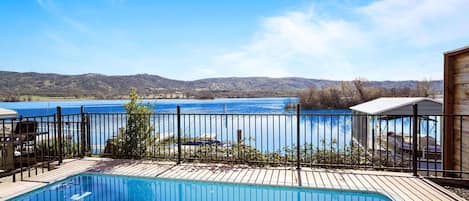 Relax poolside right on the lake! Views are breathtaking!