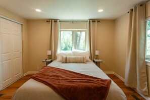 Cozy bedroom retreat with soft lighting and serene views to ensure a restful stay.