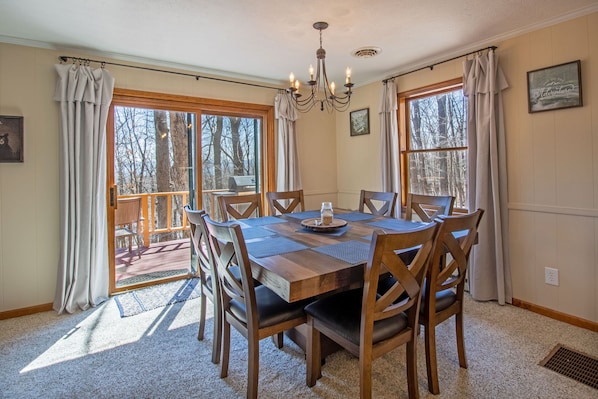 Dining area with seating for 8 and access to outdoor deck