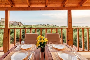 Relax and enjoy the villa balcony's serene moments