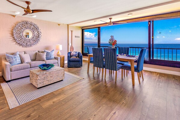 Enclosed lanai with ocean front view - Spacious living room with direct ocean views.