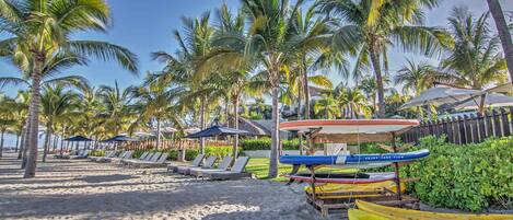 Beach area with kayaks and paddleboards available