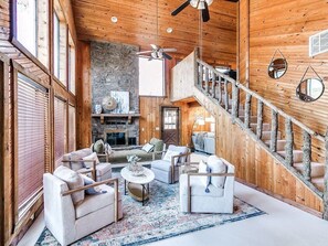 Plenty of seating in the living room with 4 swivel chairs & a day bed 
