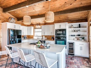 Fully stocked kitchen with large kitchen island and open floor conecpt