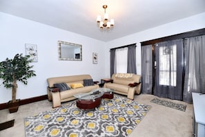 Front family room area. Couch on wall with mirror technically could allow one more sleeper.