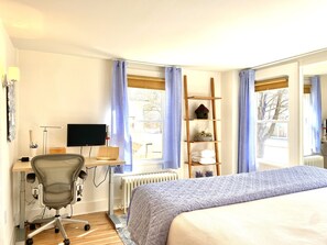 The sunny south/SE exposure front bedroom has a dedicated work area.