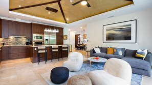 Vaulted grass cloth ceilings with modern decor throughout the home