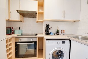 Kitchen: Whip up a feast in this stylish kitchen with modern appliances and charming decor!